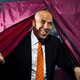 Booker emerges from the voting booth in Newark.
